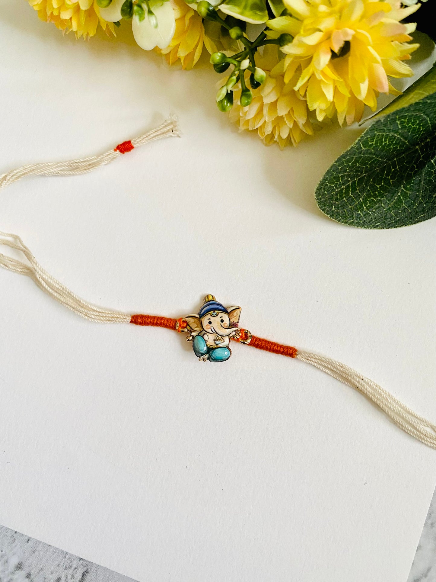 Ganesha white dori Kids Rakhi