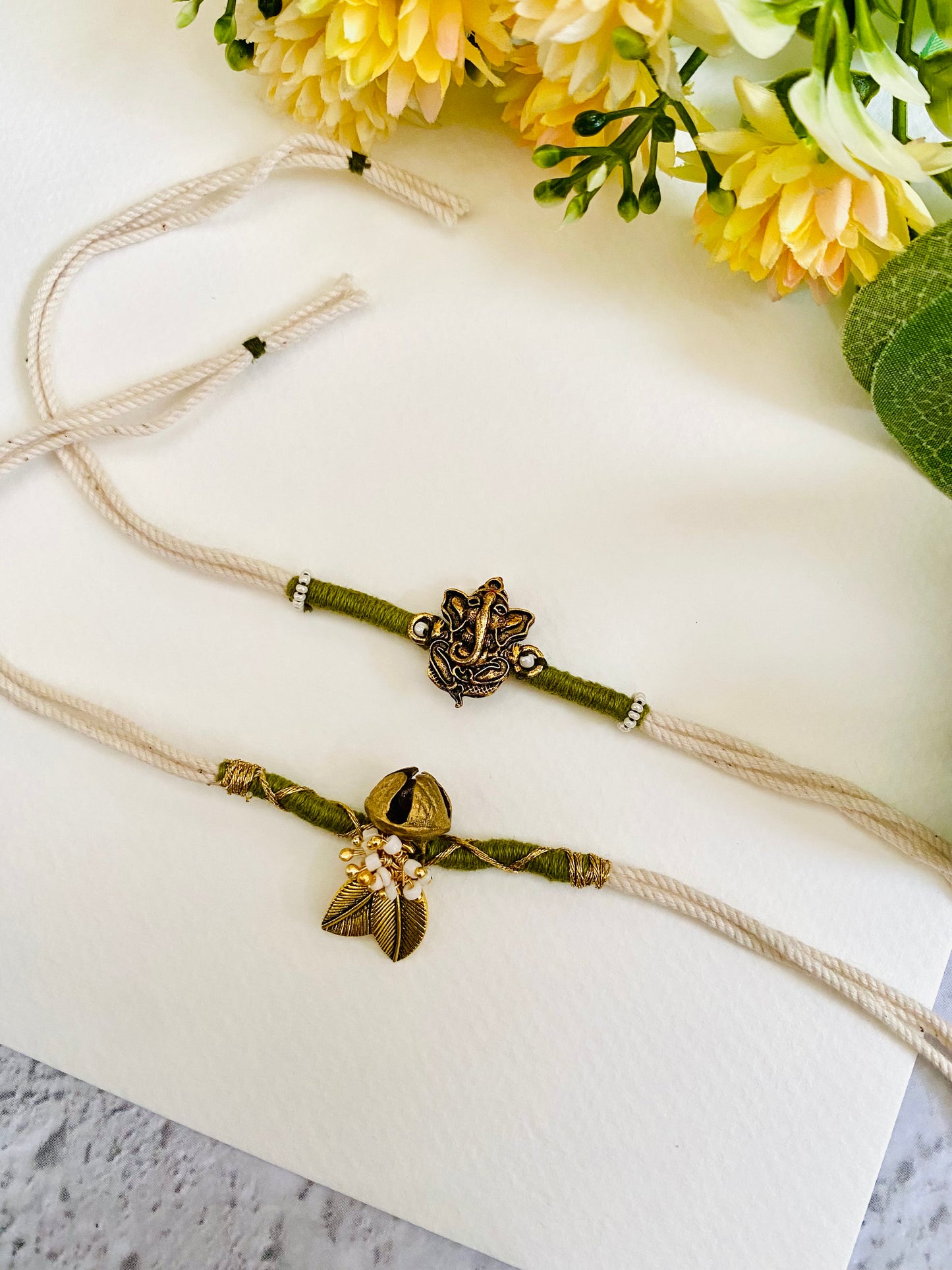 Ganesha And Ghungharoo Handmade Bhai Bhabhi Rakhi Set