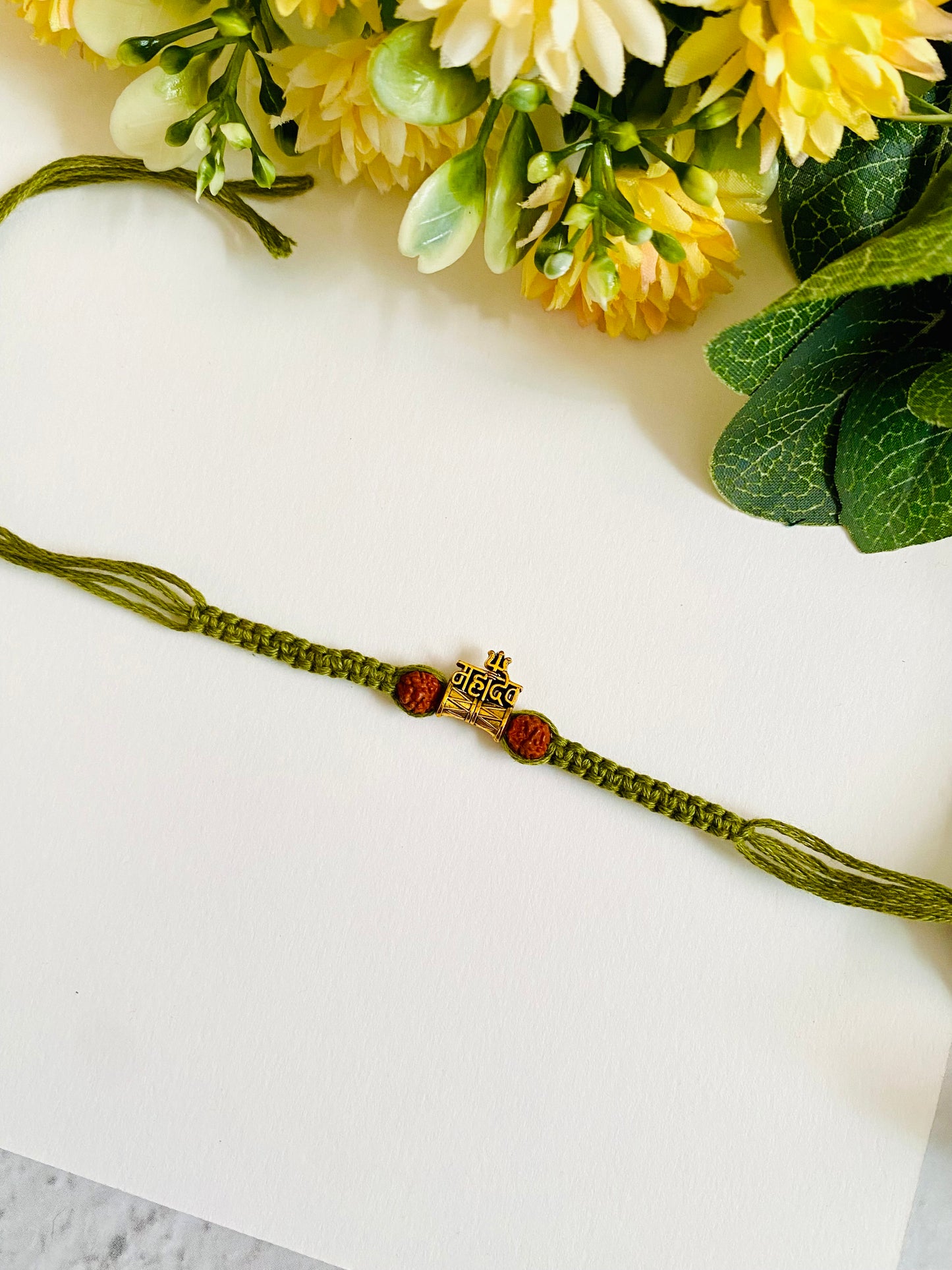 Mahadev knotting belt bhai rakhi