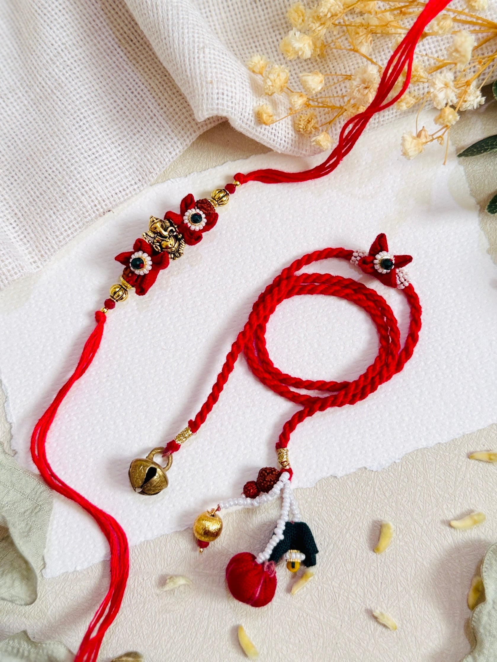 Ganesha And Flower Designer Lumba Bhai Bhabhi Rakhi Set