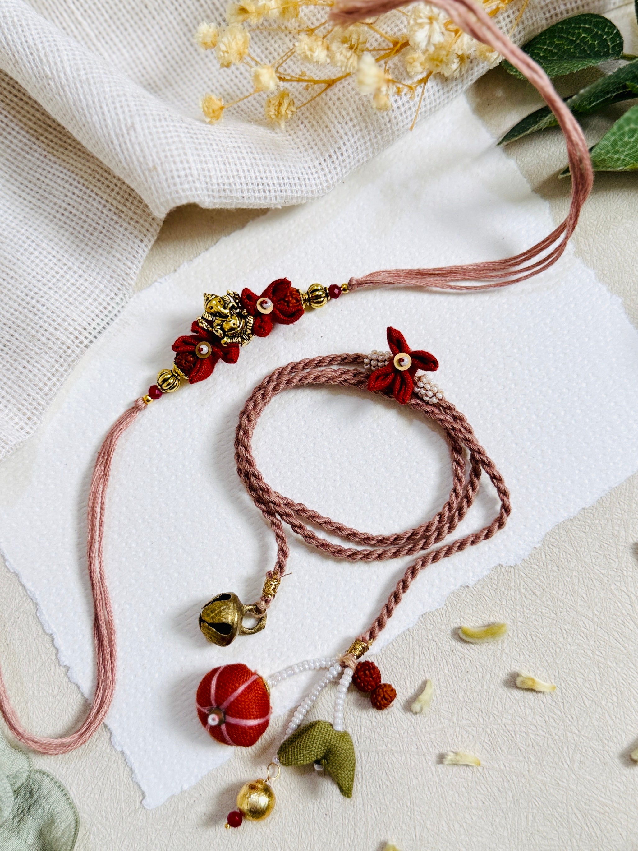 Ganesha And Flower Designer Lumba Bhai Bhabhi Rakhi Set