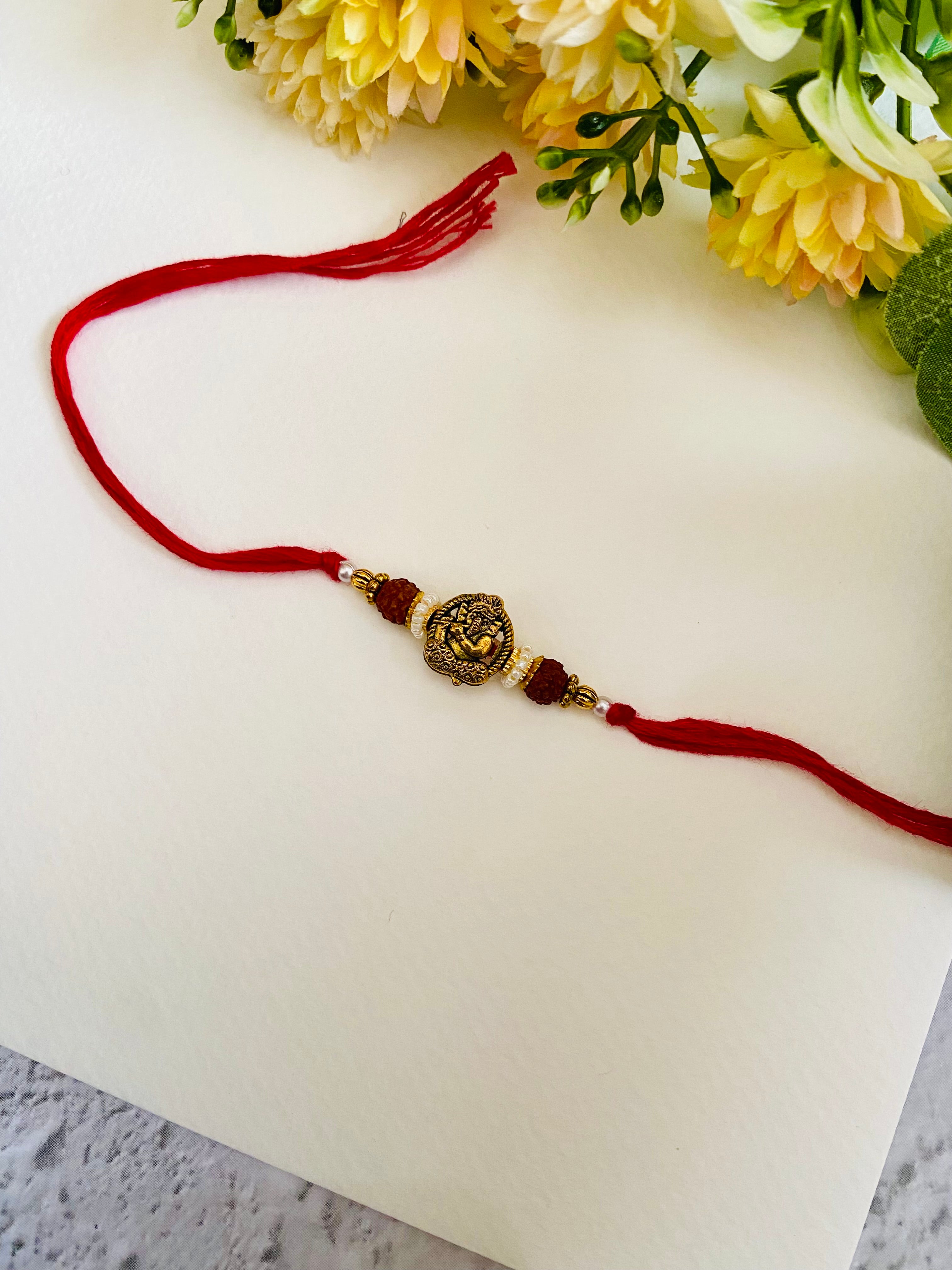 Flute ganesha bead bhai rakhi