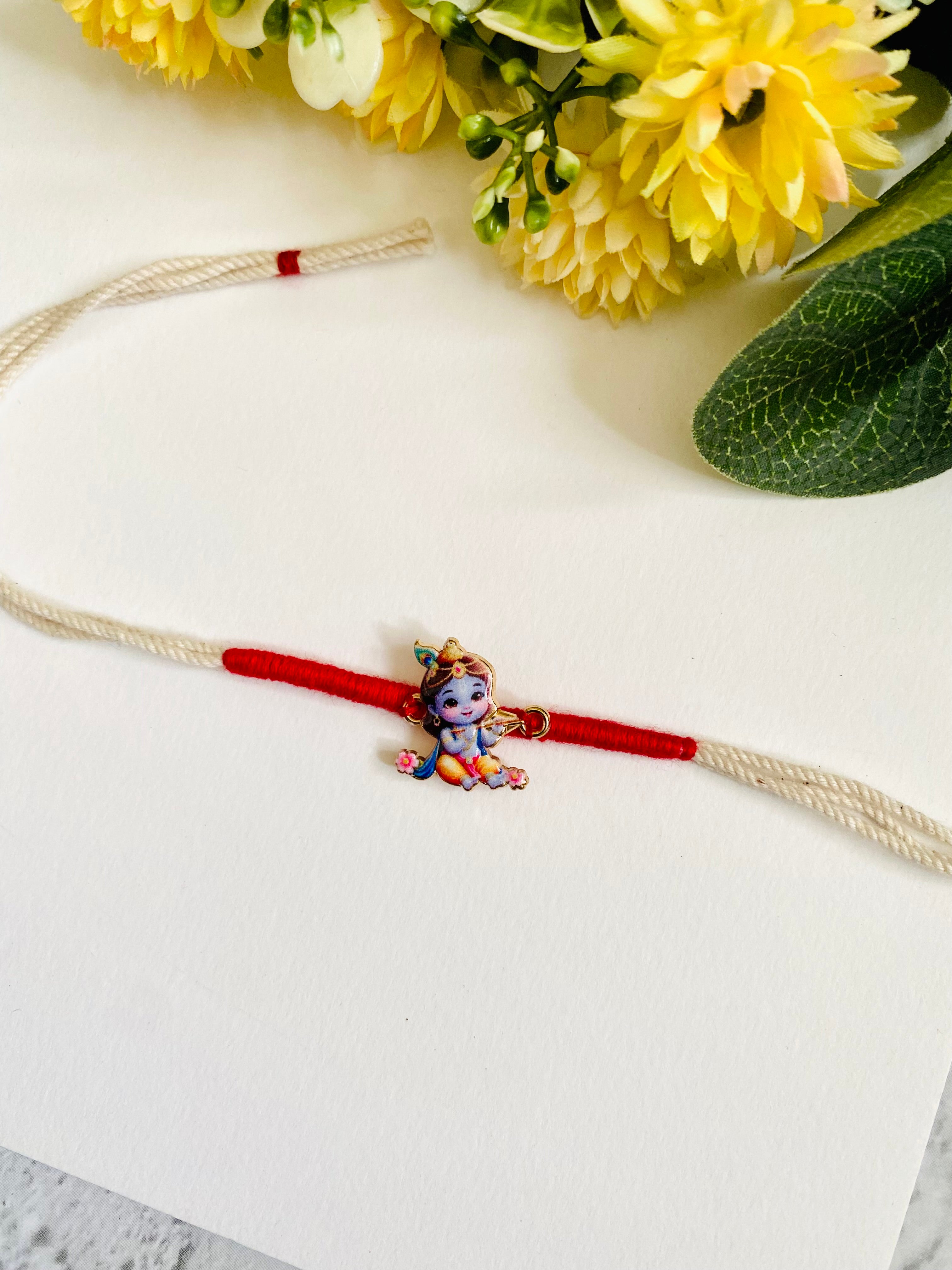 Krishna flute white dori Kids Rakhi