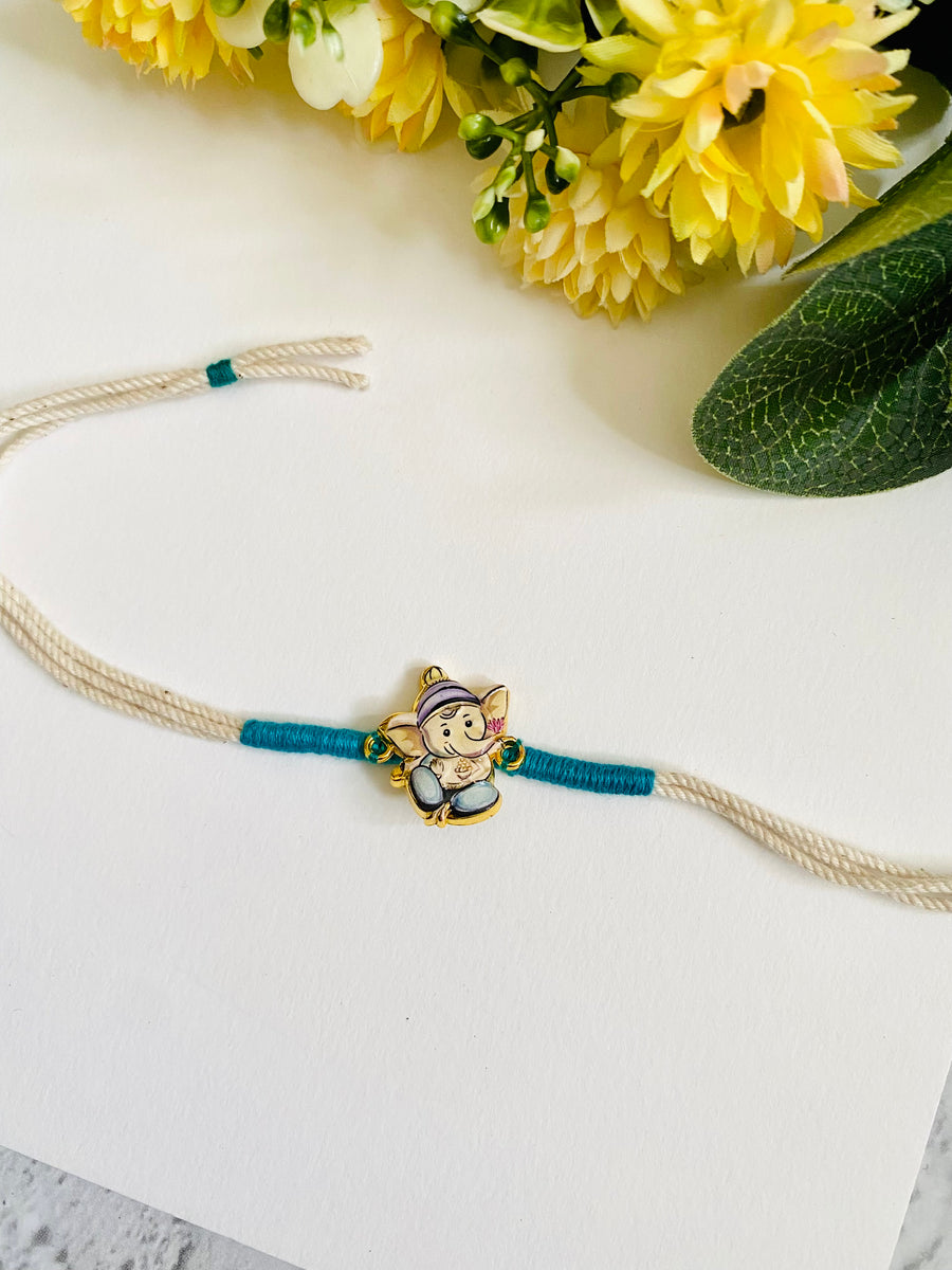 Ganpati white dori Kids Rakhi