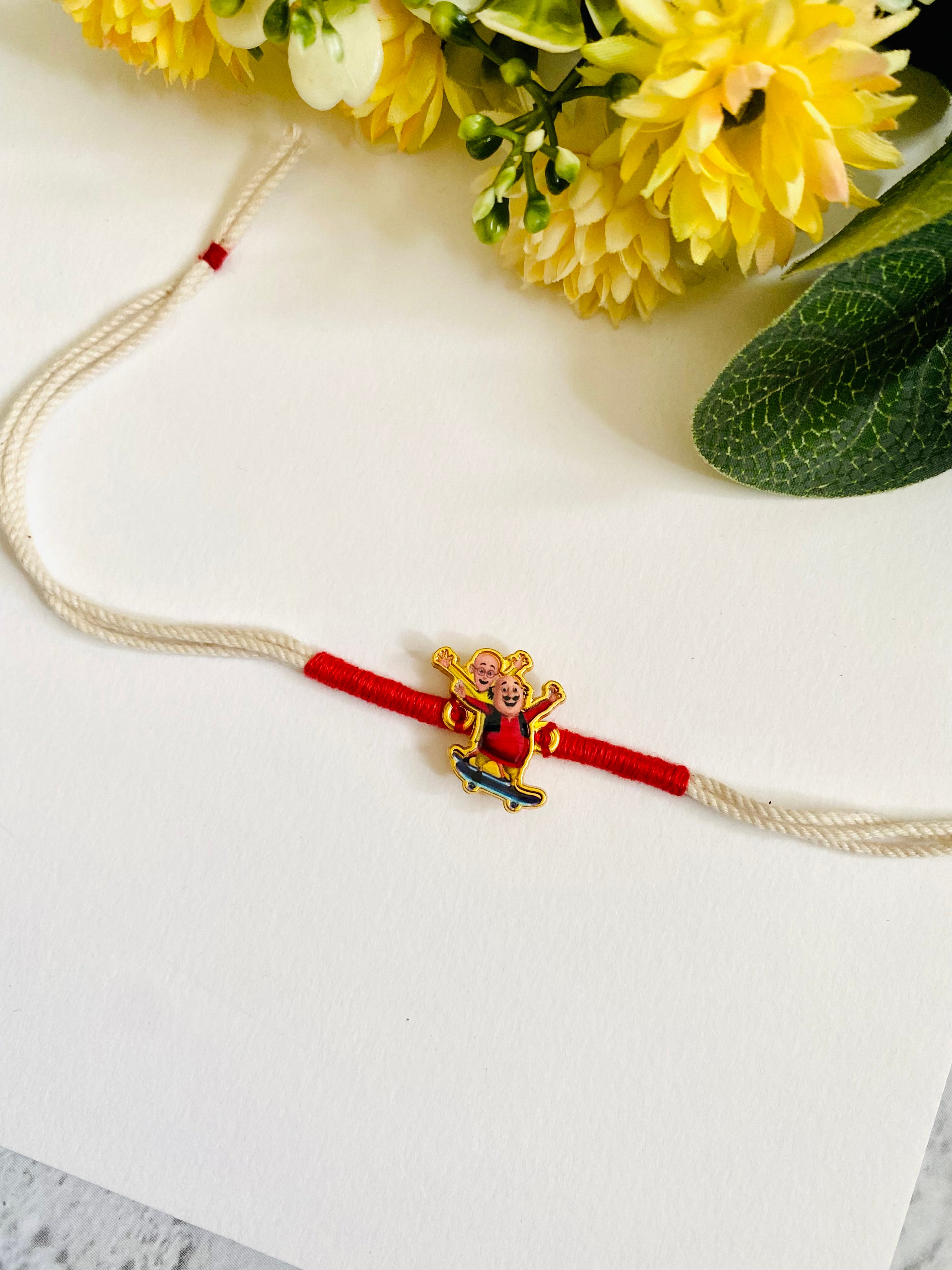 Motu Patlu white dori Kids Rakhi