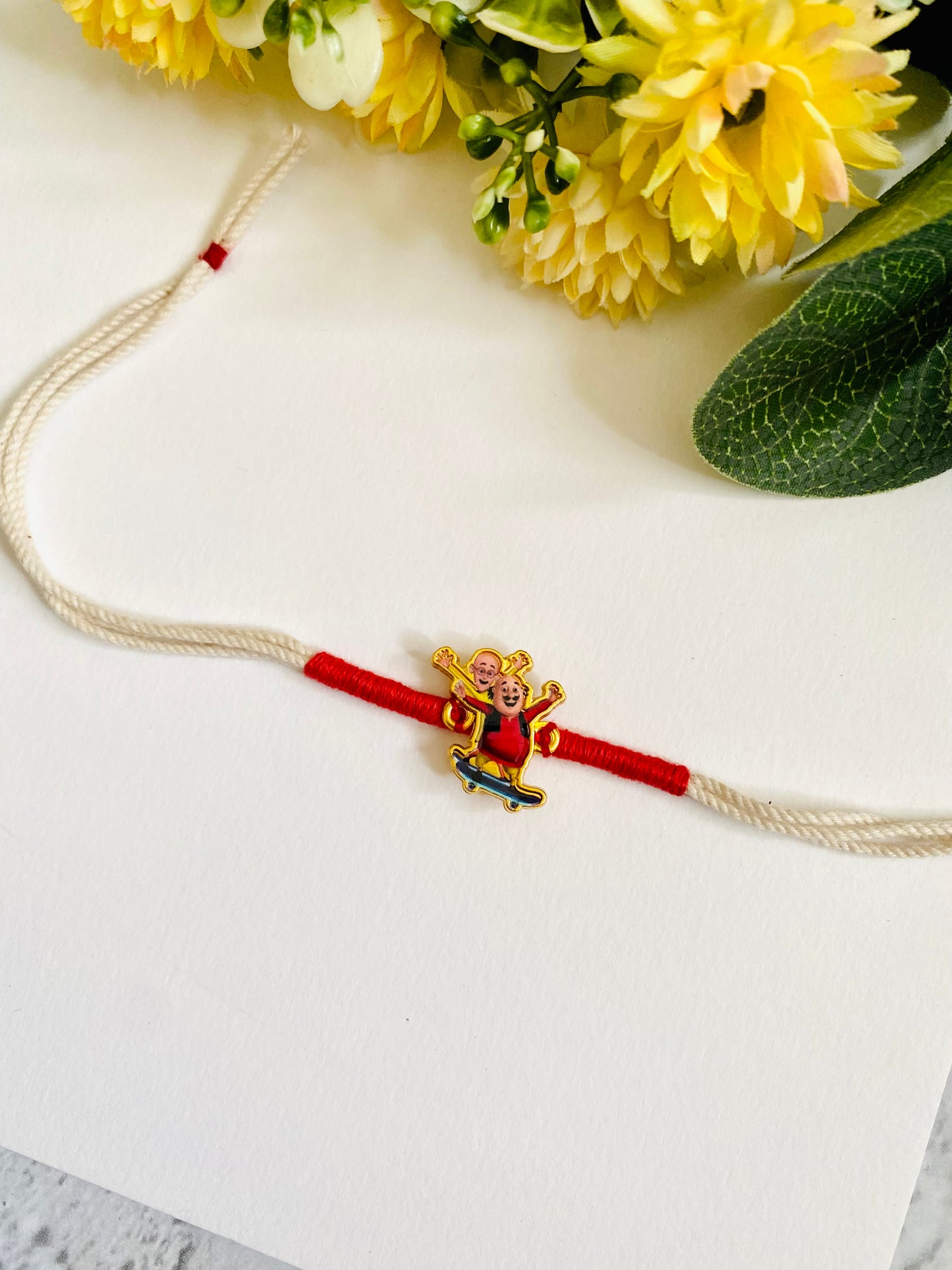 Motu Patlu white dori Kids Rakhi