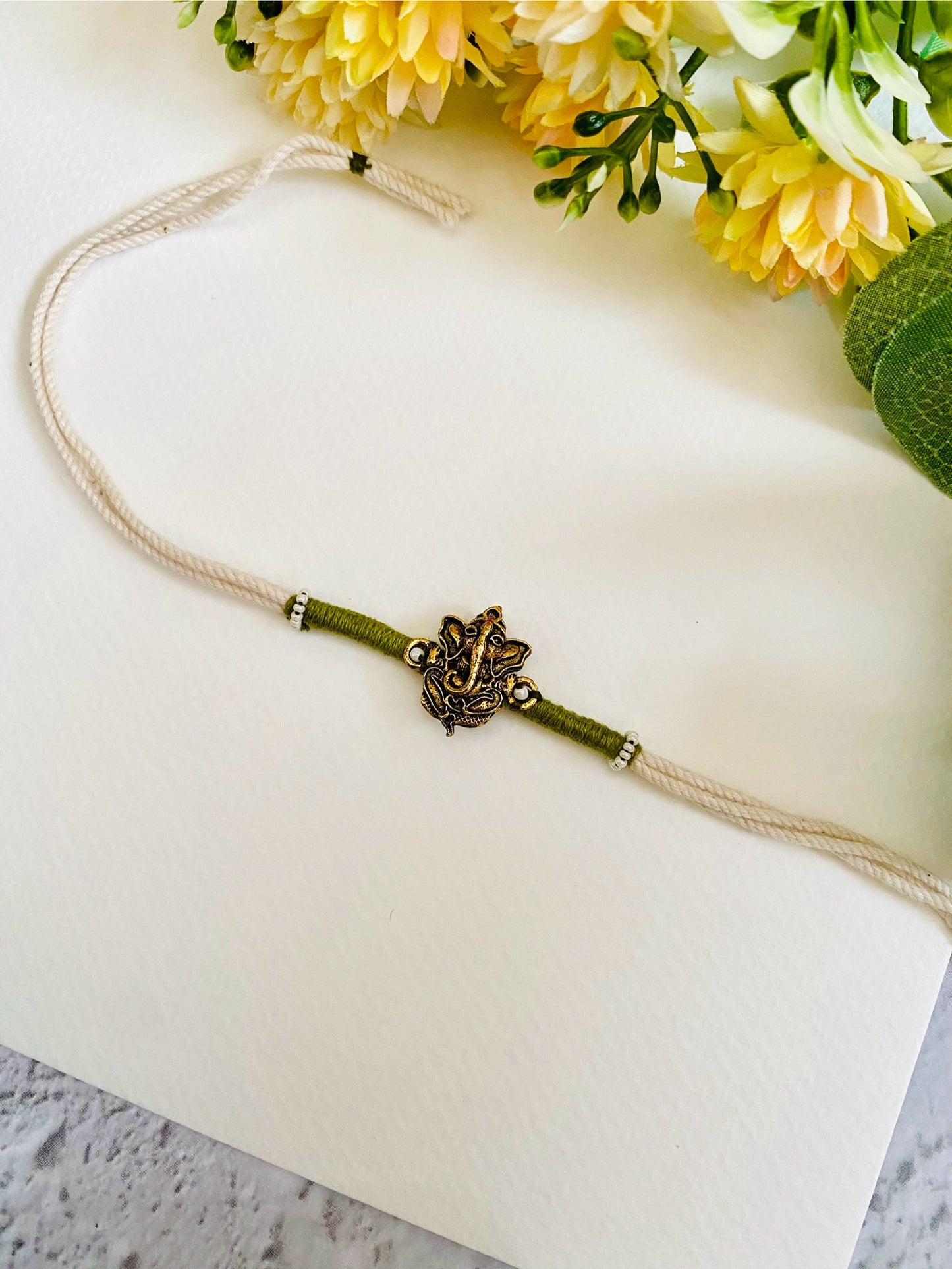 Ganesha Handmade White Dori Bhai Rakhi