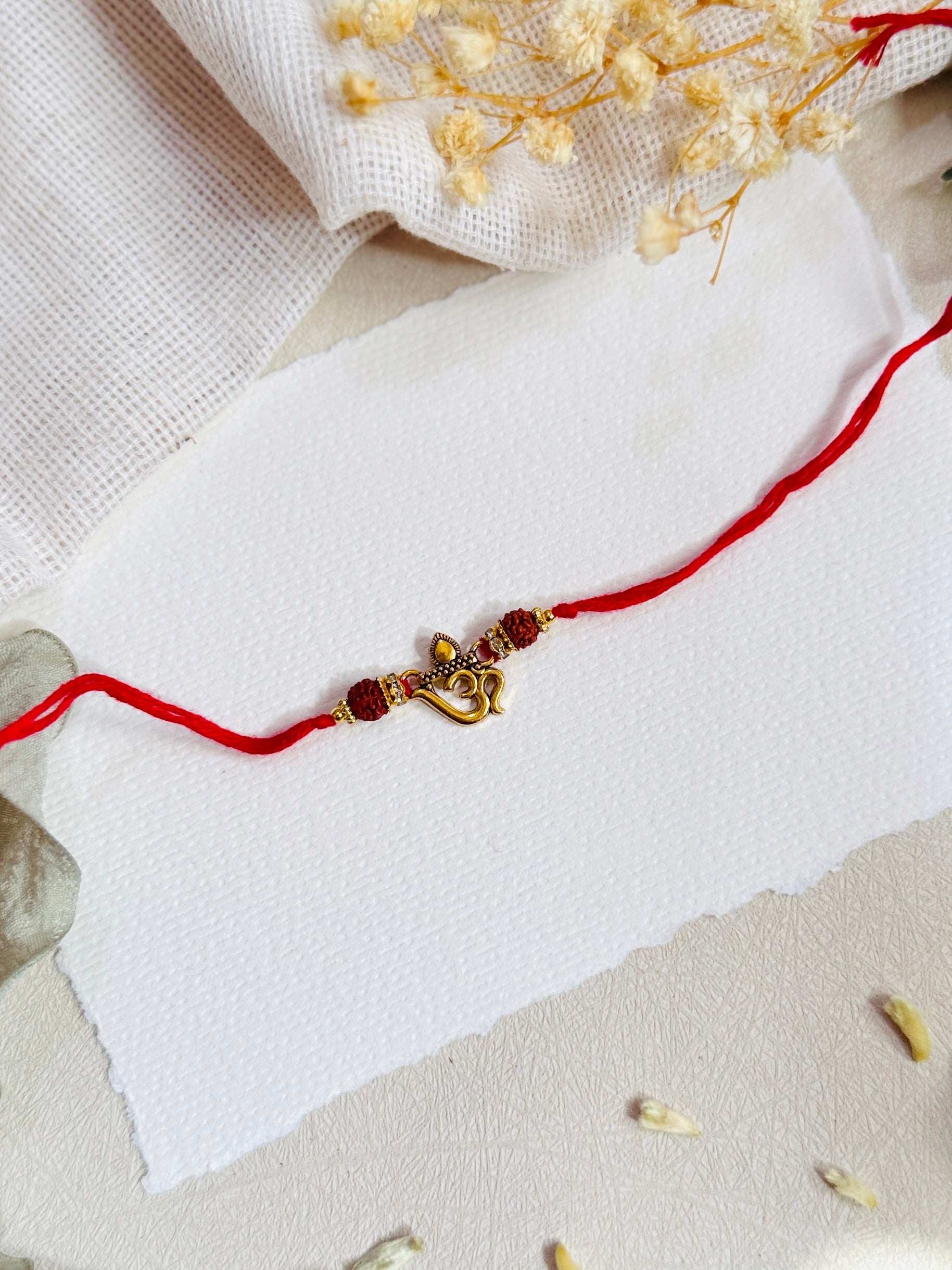 Om Flute Divine Bead Rakhi