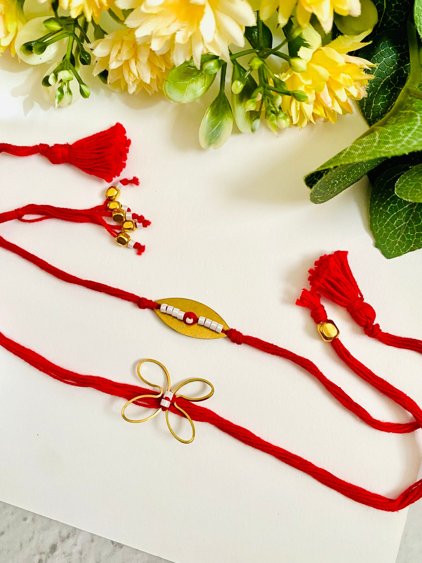 Golden Evil Eye And Butterfly Bhai Bhabhi Rakhi Set