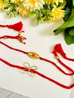 Golden Evil Eye And Butterfly Bhai Bhabhi Rakhi Set