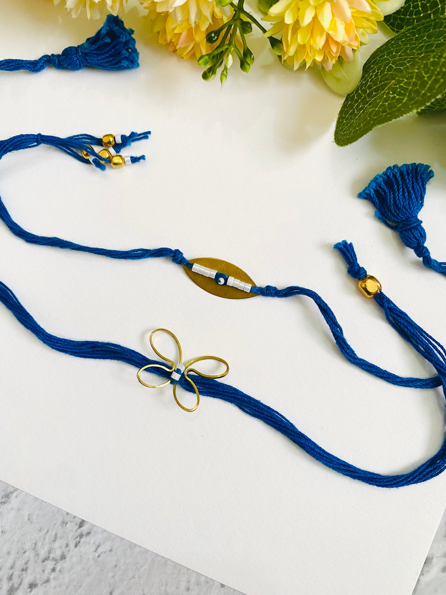 Golden Evil Eye And Butterfly Bhai Bhabhi Rakhi Set