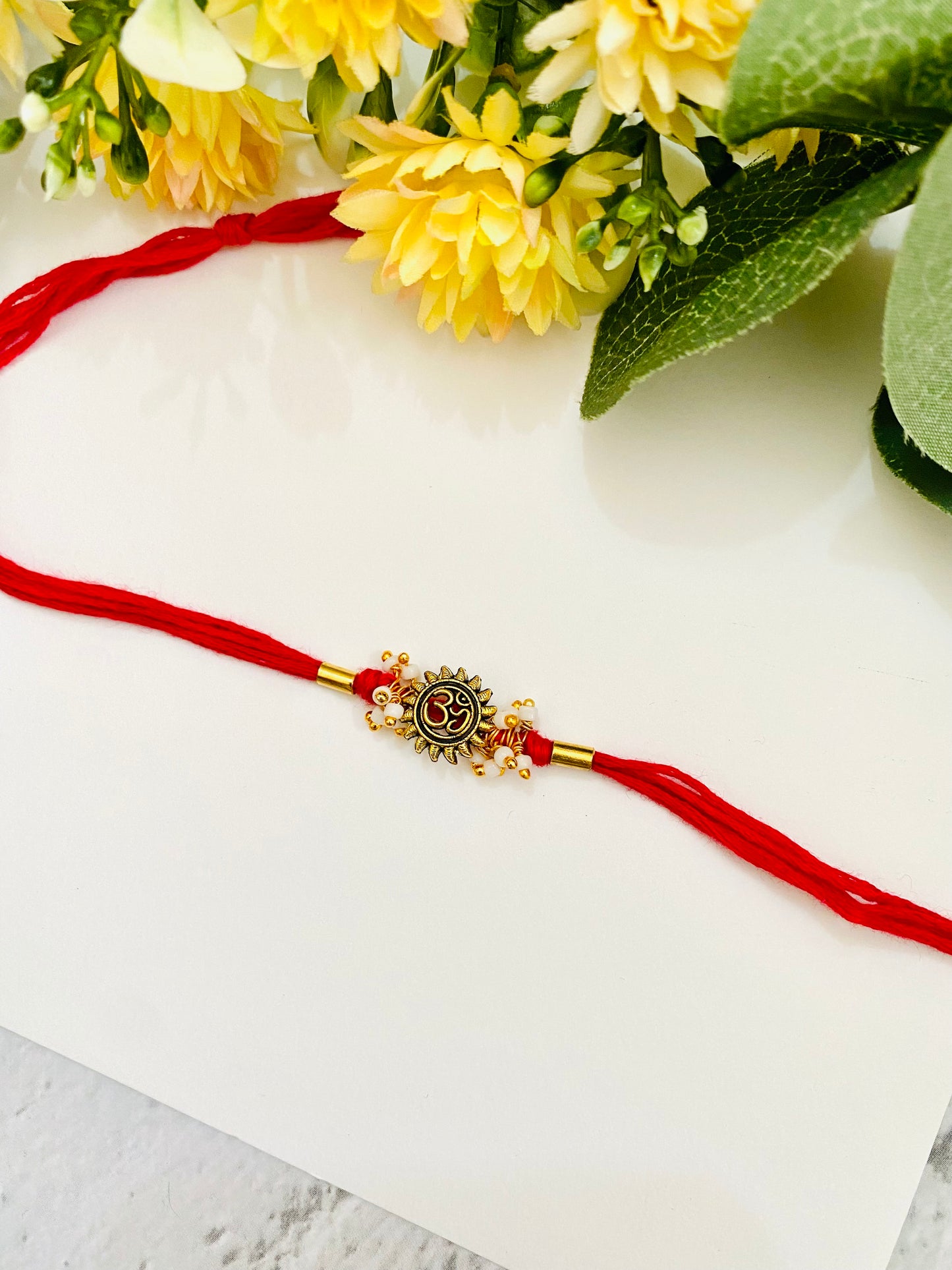 Om Sun pipe bead bhabhi rakhi