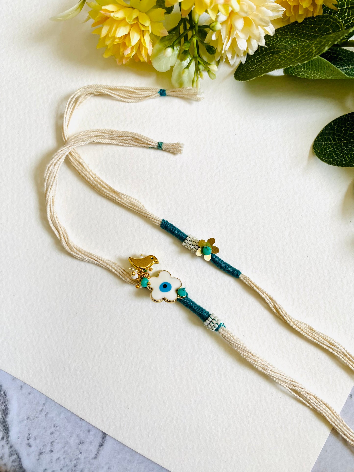 Flower Evil Eye Charm Bhai Bhabhi Rakhi Set