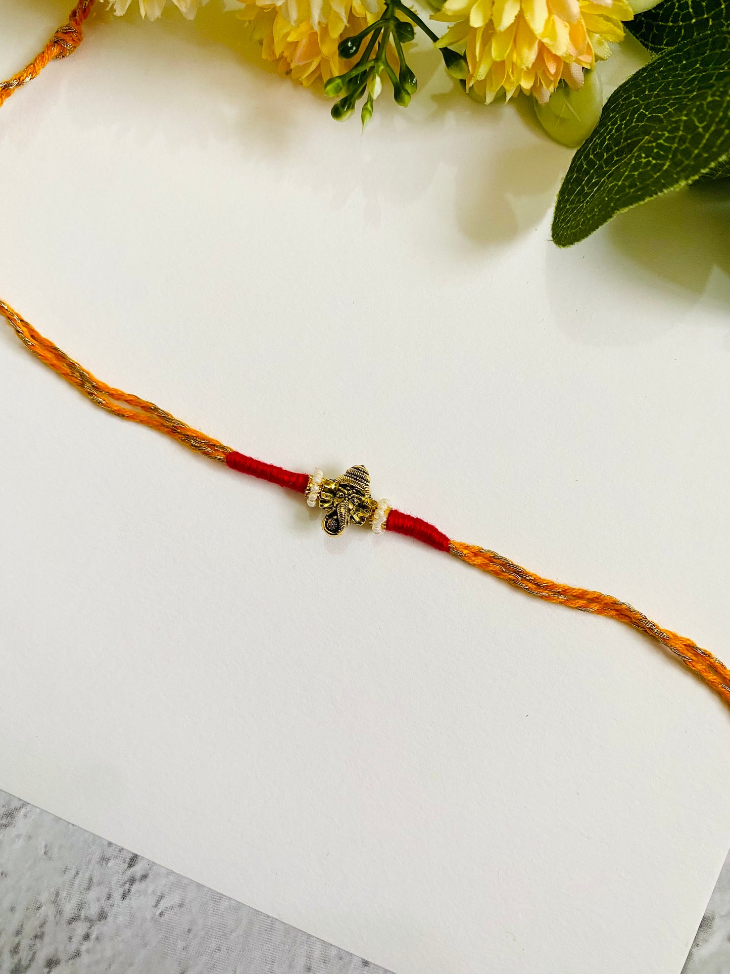 Ganesha Yellow Twisted Dori Bhai Rakhi