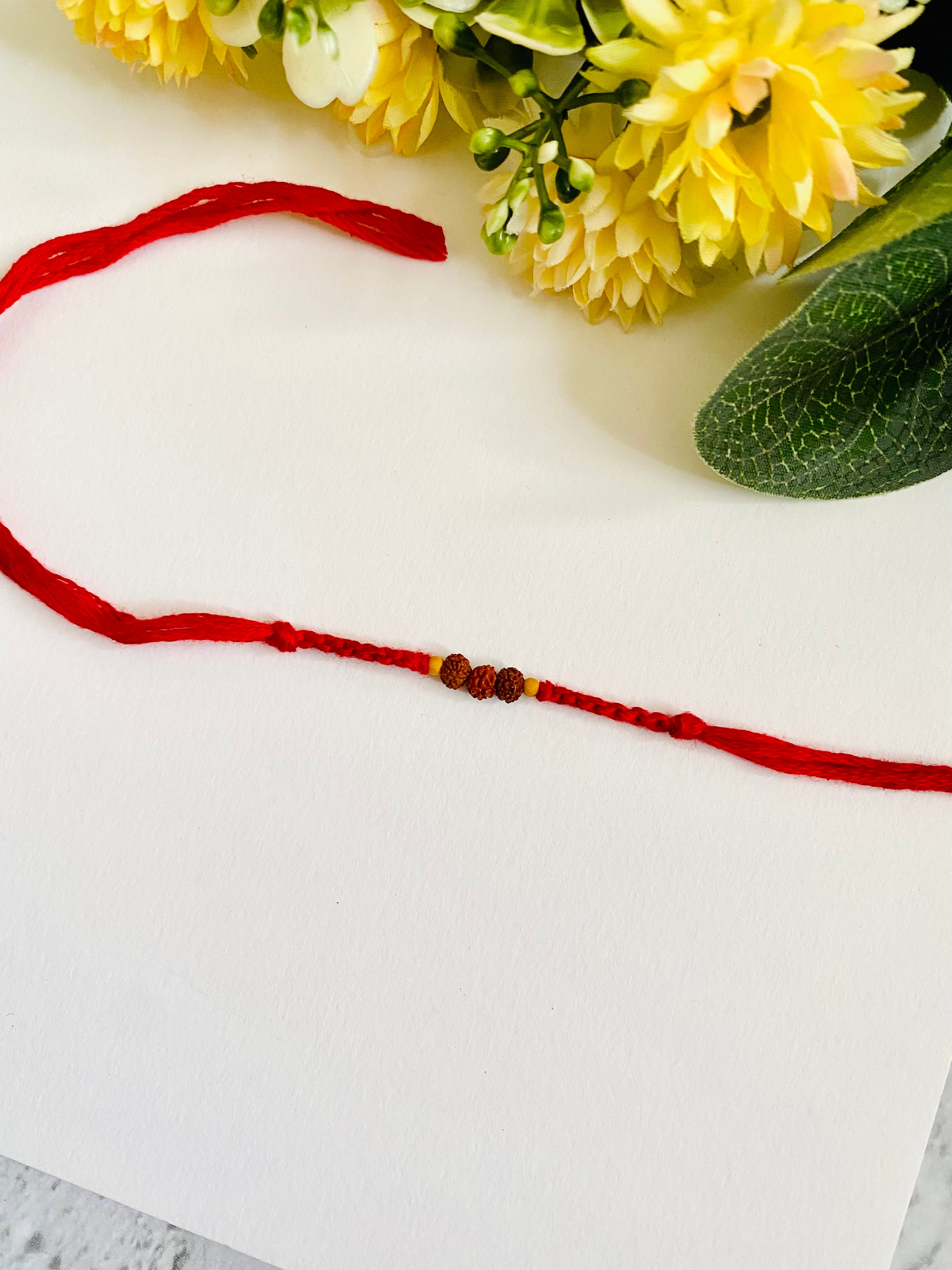 Three small rudraksh knotting belt bhai rakhi
