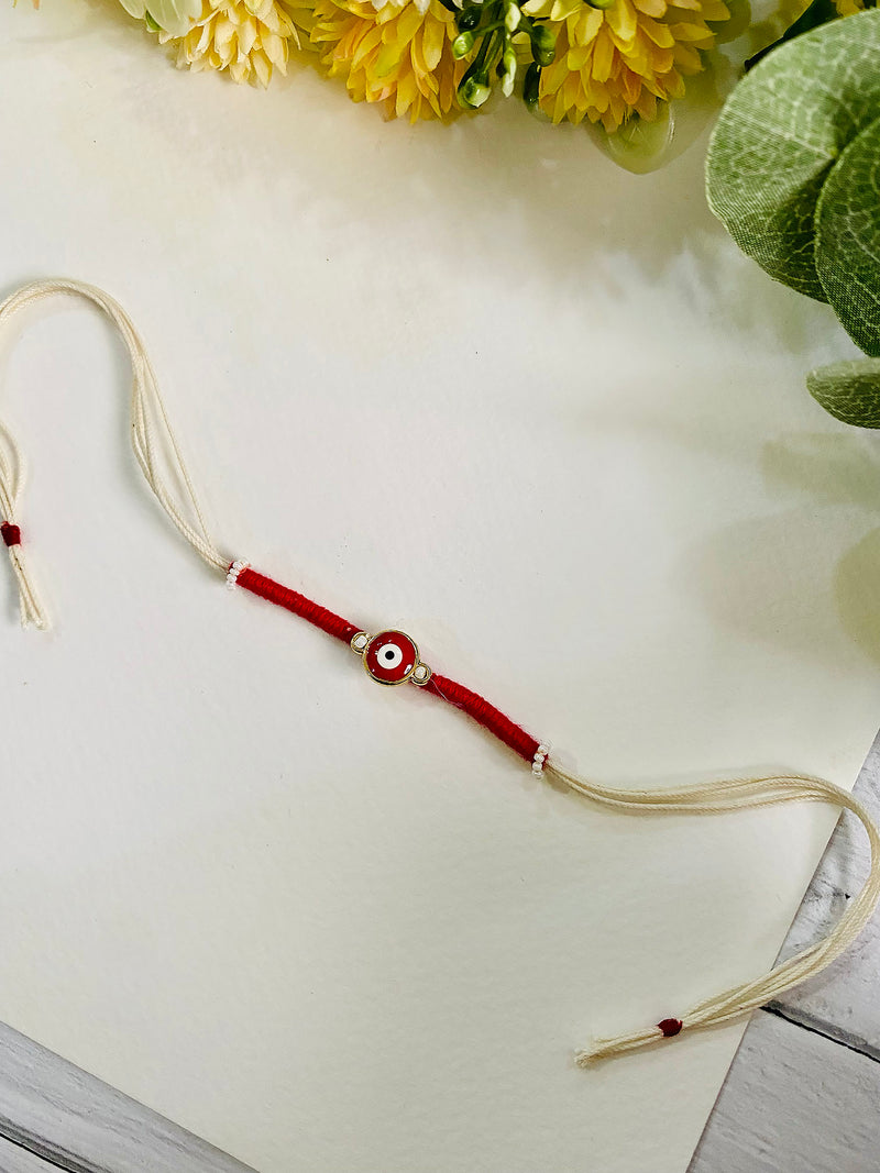 Handmade Evil Eye Rakhi for Brother - a unique and beautiful rakhi available for online rakhi delivery. Perfect for Raksha Bandhan, this rakhi is part of our best rakhi for brother collection.