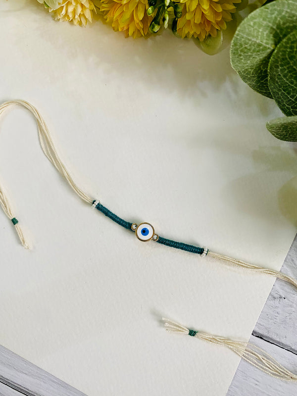 Handmade Evil Eye Rakhi for Brother - a unique and beautiful rakhi available for online rakhi delivery. Perfect for Raksha Bandhan, this rakhi is part of our best rakhi for brother collection.