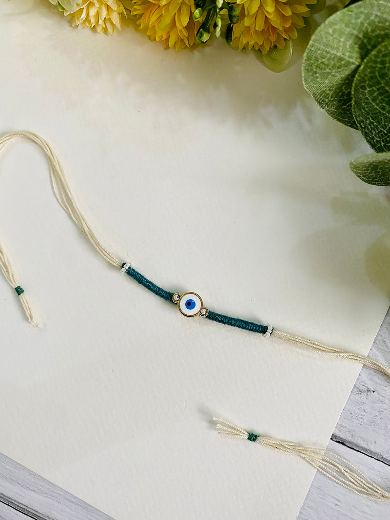 Handmade Evil Eye Rakhi for Brother - a unique and beautiful rakhi available for online rakhi delivery. Perfect for Raksha Bandhan, this rakhi is part of our best rakhi for brother collection.